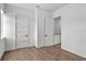 Minimalist bedroom with two doors and luxury vinyl plank flooring at 1780 Mizell Ave., Winter Park, FL 32789