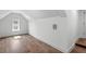 Cozy, minimalist bedroom with luxury vinyl plank flooring, and a small window at 1780 Mizell Ave., Winter Park, FL 32789