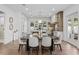 Modern dining area with stylish table, chairs, and view into the gourmet kitchen at 1780 Mizell Ave., Winter Park, FL 32789