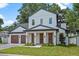 Charming two-story home featuring a well-manicured lawn and black framed windows at 1780 Mizell Ave., Winter Park, FL 32789