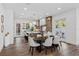 Open-concept kitchen with large island, pendant lighting, stainless steel appliances, and hardwood floors at 1780 Mizell Ave., Winter Park, FL 32789