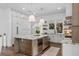 Spacious kitchen with granite countertops, a wine refrigerator, custom cabinets, and stainless appliances at 1780 Mizell Ave., Winter Park, FL 32789