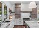 Close up of the sink, custom countertops, and cabinets of the updated kitchen at 1780 Mizell Ave., Winter Park, FL 32789