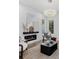 Inviting living room featuring hardwood floors, a modern fireplace, and elegant furniture at 1780 Mizell Ave., Winter Park, FL 32789