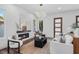 Cozy living room featuring hardwood floors, a modern fireplace, and elegant furniture at 1780 Mizell Ave., Winter Park, FL 32789