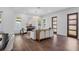Elegant living room featuring hardwood floors, a modern fireplace, and abundant natural light at 1780 Mizell Ave., Winter Park, FL 32789