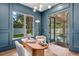 Bright, stylish office with pool access showcasing a modern desk, and hardwood floors at 1780 Mizell Ave., Winter Park, FL 32789