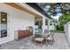 Inviting outdoor kitchen featuring a grill, counter space, and dining area on a brick patio at 1780 Mizell Ave., Winter Park, FL 32789