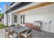 Covered outdoor kitchen and dining area featuring premium grill and finishes at 1780 Mizell Ave., Winter Park, FL 32789