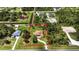 Aerial view of a single Gathering home on a large lot, surrounded by trees and other houses at 19606 Reynolds Pkwy, Orlando, FL 32833