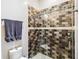 Bathroom featuring a tiled shower enclosure with a modern showerhead and a glass door at 19606 Reynolds Pkwy, Orlando, FL 32833