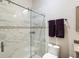 Sleek bathroom with a glass-enclosed shower, decorative tile, and modern fixtures at 19606 Reynolds Pkwy, Orlando, FL 32833