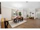 Bright dining room with modern lighting, hardwood floors, large windows and stylish decor at 19606 Reynolds Pkwy, Orlando, FL 32833