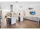 Open-concept kitchen featuring a large island with seating, modern appliances, and seamless flow to the living area at 19606 Reynolds Pkwy, Orlando, FL 32833