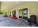 Spacious covered patio with brick pavers, offering a great outdoor living space at 19606 Reynolds Pkwy, Orlando, FL 32833