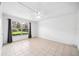 Bright bedroom with neutral tile flooring, ceiling fan and large windows at 200 St Andrews Blvd # 601, Winter Park, FL 32792