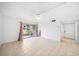Spacious living room with a ceiling fan, neutral tile flooring and large sliding glass doors at 200 St Andrews Blvd # 601, Winter Park, FL 32792
