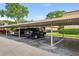 Covered parking area providing reserved parking spaces for residents and guests at 200 St Andrews Blvd # 601, Winter Park, FL 32792