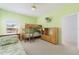 Bright bedroom featuring bunk beds, a dresser, and doorway to another room at 20130 Sunset Landing Ave, Groveland, FL 34736