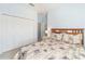 Cozy bedroom featuring a full bed, closet, and nearby bathroom at 20130 Sunset Landing Ave, Groveland, FL 34736