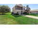 Charming two-story home with manicured lawn at 20130 Sunset Landing Ave, Groveland, FL 34736