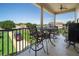 Covered patio with ceiling fan and outdoor dining set, perfect for enjoying outdoor meals with a view at 20130 Sunset Landing Ave, Groveland, FL 34736