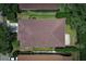 An aerial shot of a residential property displaying a well maintained roof and fenced in yard at 203 Brookgreen Way, Deland, FL 32724