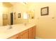 Bathroom featuring large mirror and double vanity at 203 Brookgreen Way, Deland, FL 32724