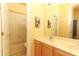 Bathroom with double sinks and a tub with shower at 203 Brookgreen Way, Deland, FL 32724