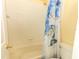 Clean bathroom featuring tiled walls, a bathtub, and a decorative shower curtain at 203 Brookgreen Way, Deland, FL 32724