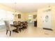 Dining room with tile floors, neutral colors, and a large dining table with seating for six at 203 Brookgreen Way, Deland, FL 32724