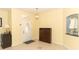 Inviting foyer featuring tile flooring, neutral wall colors, and decorative niche for displaying decor at 203 Brookgreen Way, Deland, FL 32724