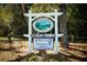 A sign for the Victoria Hills Golf Club, advertising it is open to the public at 203 Brookgreen Way, Deland, FL 32724
