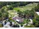 An overhead view of the meticulously maintained golf course, complemented by the presence of a charming clubhouse at 203 Brookgreen Way, Deland, FL 32724