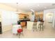 Spacious eat-in kitchen with wood cabinetry and a breakfast bar for casual dining at 203 Brookgreen Way, Deland, FL 32724