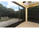 Enclosed lanai with access to a brick patio and landscaped backyard at 203 Brookgreen Way, Deland, FL 32724