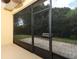 Enclosed lanai with access to a private outdoor brick patio at 203 Brookgreen Way, Deland, FL 32724