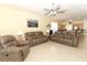 Open-concept living room area with views of the kitchen and a comfortable seating arrangement at 203 Brookgreen Way, Deland, FL 32724