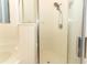 Walk-in shower with rainfall shower head and glass doors at 203 Brookgreen Way, Deland, FL 32724