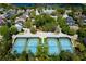 Aerial view of community tennis courts, perfect for recreational play and fitness activities at 203 Brookgreen Way, Deland, FL 32724