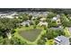 Aerial view of neighborhood featuring backyard ponds and mature trees at 205 Trail Bridge Ct, Winter Garden, FL 34787