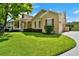 Charming two-story home with lush lawn and well-maintained landscaping at 205 Trail Bridge Ct, Winter Garden, FL 34787