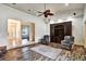 Elegant living room with hardwood floors, a built-in entertainment center, and vaulted ceilings at 205 Trail Bridge Ct, Winter Garden, FL 34787