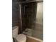Bathroom shower with a sliding glass door and tile features at 229 Doverwood Rd, Fern Park, FL 32730