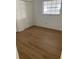 This bedroom offers new laminate flooring, closet, and a window to allow for ample natural light at 229 Doverwood Rd, Fern Park, FL 32730