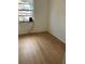 Bedroom featuring wood floors and natural light from the window at 229 Doverwood Rd, Fern Park, FL 32730