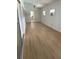 Bright living room featuring new laminate flooring, fresh paint, and neutral color palette at 229 Doverwood Rd, Fern Park, FL 32730