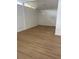 Bright living room featuring new laminate flooring, modern chandelier, and neutral color palette at 229 Doverwood Rd, Fern Park, FL 32730