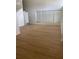 Spacious living room with large windows and laminate flooring, offering ample natural light at 229 Doverwood Rd, Fern Park, FL 32730