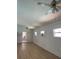 Spacious living room illuminated by ceiling fans and natural light from the surrounding windows at 229 Doverwood Rd, Fern Park, FL 32730